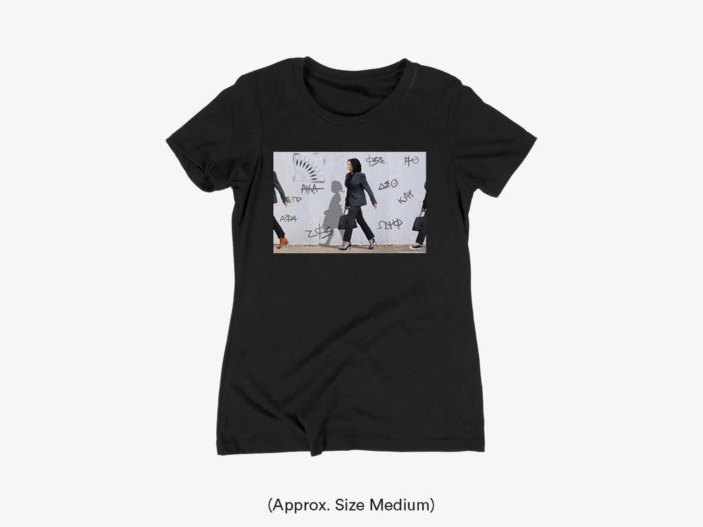 A Black t-shirt with a graphic print of a person in a suit walking