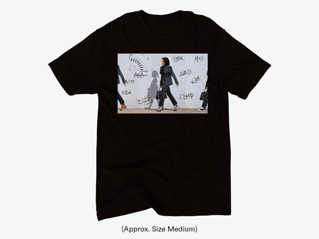 Black T-shirt with a graphic print featuring Harris Kamala walking and surrounded by abstract designs and text.
